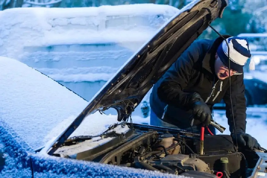 How do you start an engine in extreme cold?